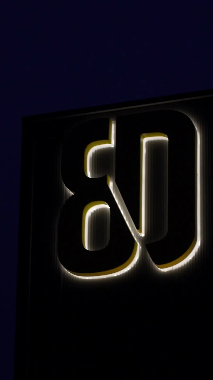 8D video frame: illuminated logo on the wall